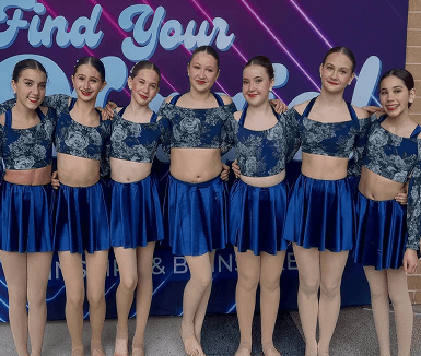 Momentum dancers posing together as a team